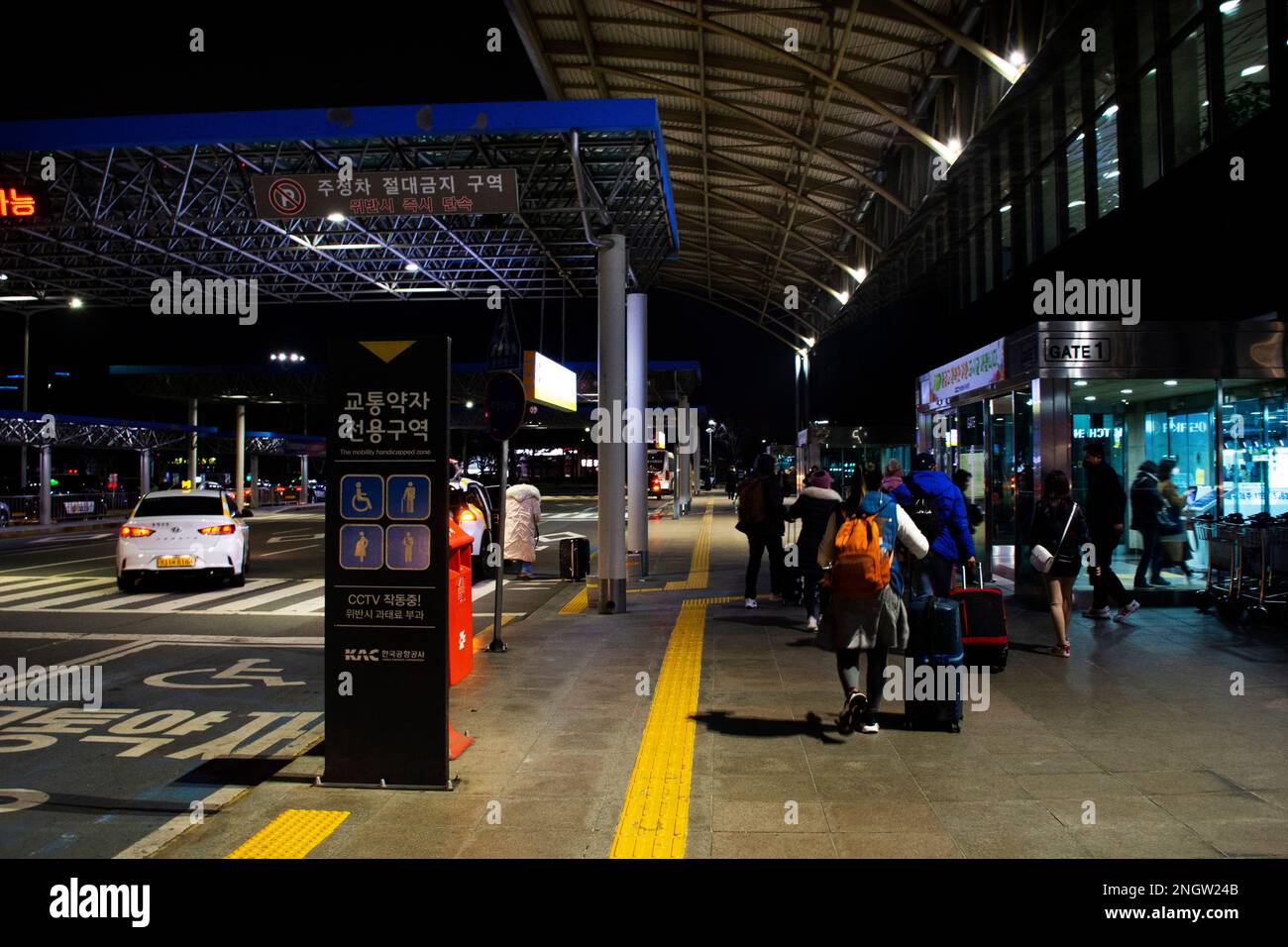 Korean people and foreign travelers passengers walking carry luggage