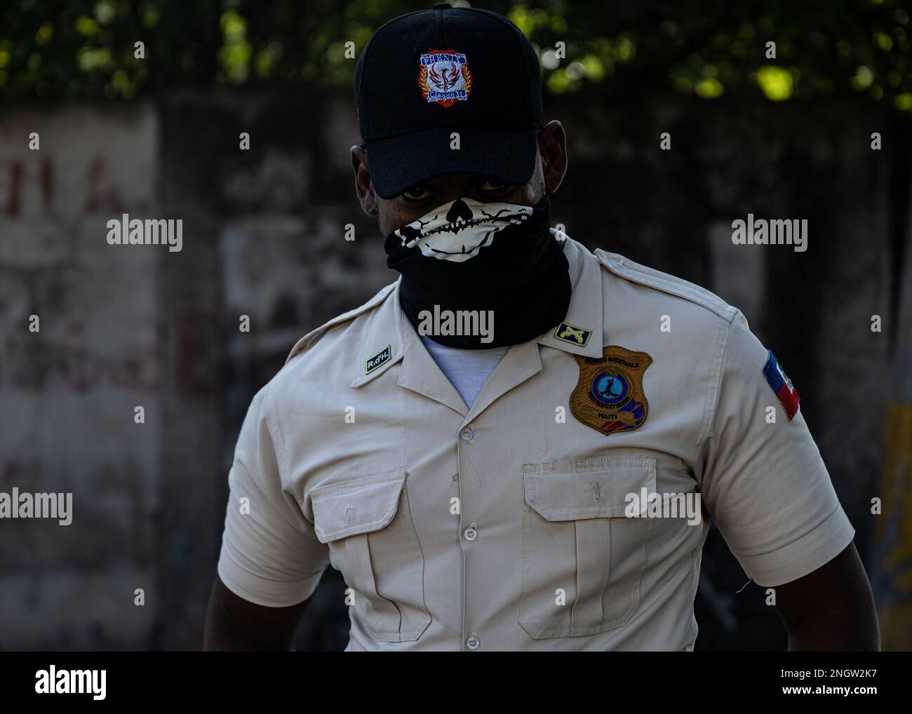 Port Au Prince, Haiti. 18th Nov, 2022. A member of the Haitian National Police monitors protesters in Port-au-Prince, Haiti on Nov. 18, 2022. (Photo by Collin Mayfield/Sipa USA) Credit: Sipa USA/Alamy Live News Stock Photo