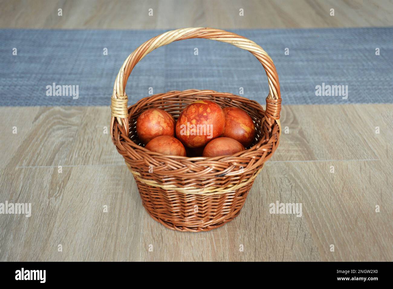Easter eggs in the basket. Easter egg dyed with onion peel. Happy Easter concept. Stock Photo