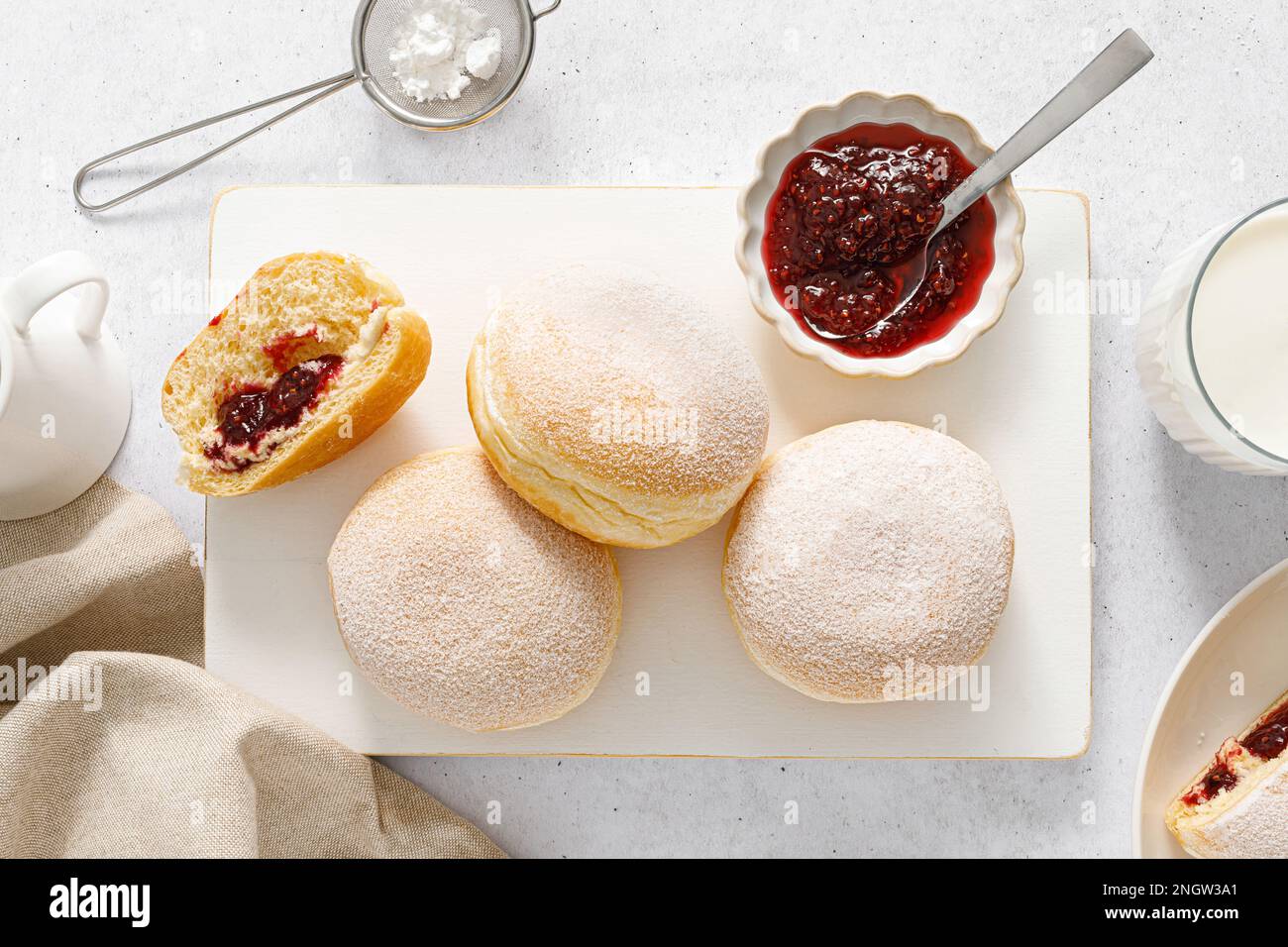 Berliner donut. Traditional german donut with raspberry jam, dusted with icing sugar. Top view Stock Photo