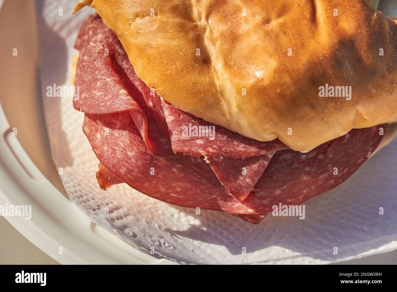 Lebanon bologna sandwich made with a pretzel roll. A Pennsylvania Dutch