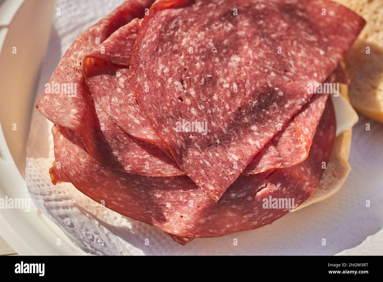 Lebanon bologna sandwich made with a pretzel roll. A Pennsylvania Dutch