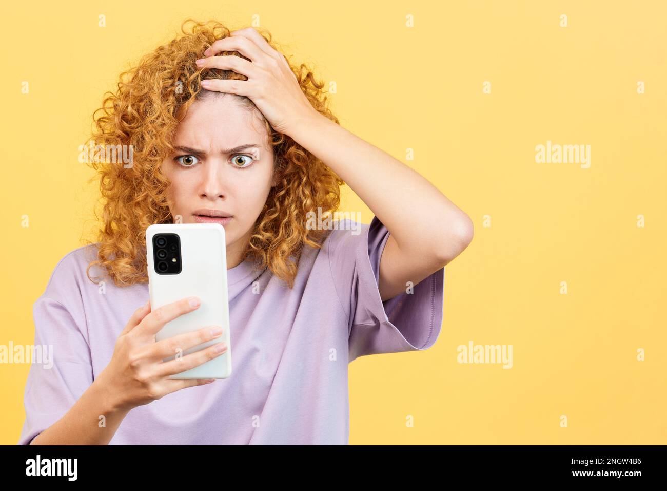 A desperate woman looking at mobile phone Stock Photo