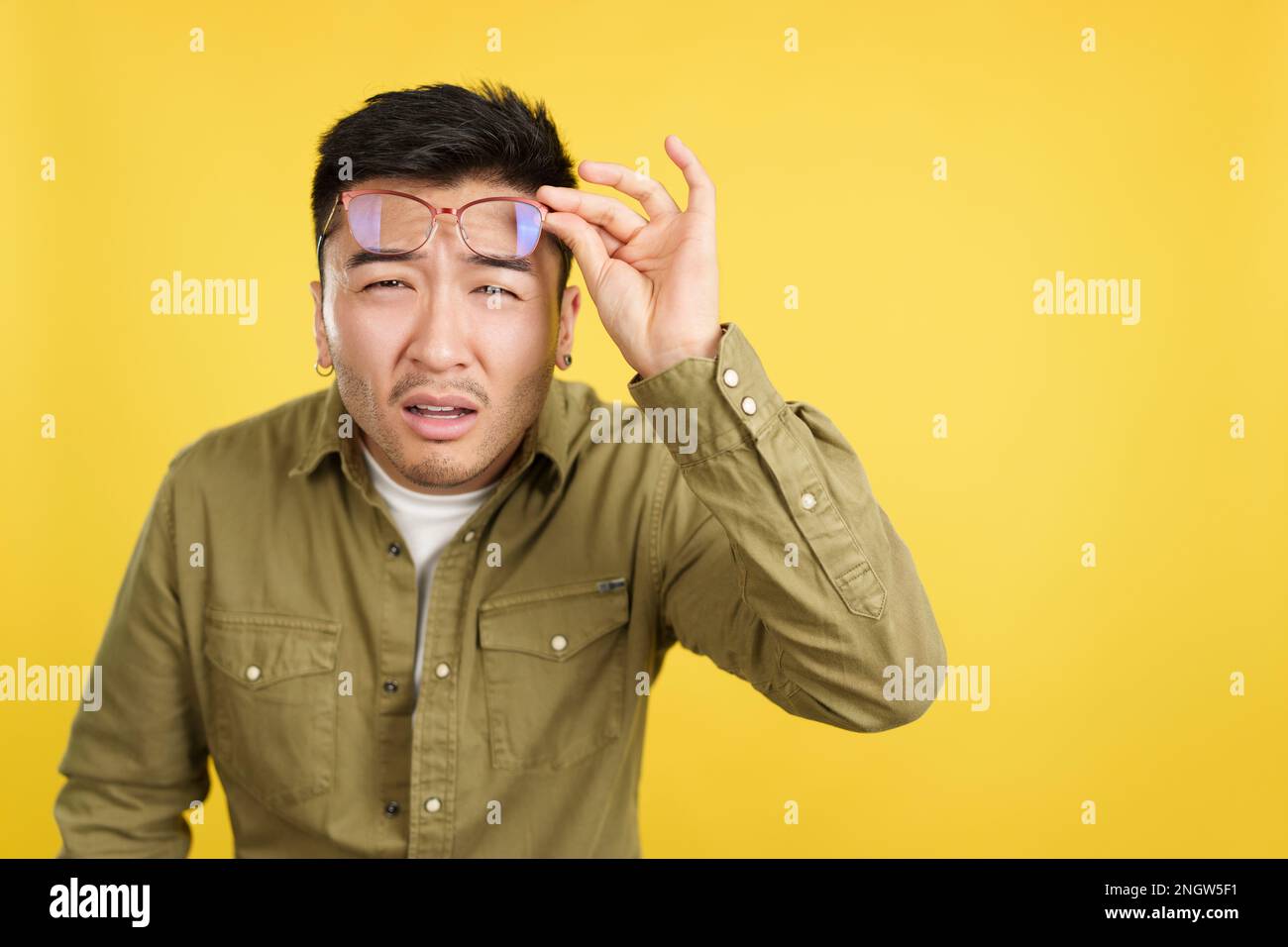 See Off Chinese man taking off her glasses to see Stock Photo - Alamy