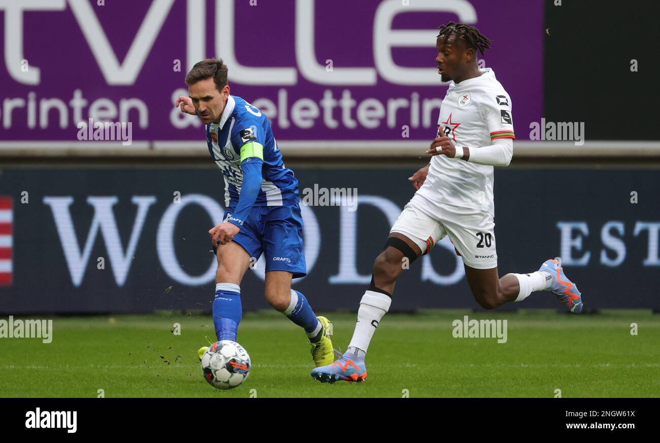 Gent's Sven Kums and OHL's Hamza Mendyl fight for the ball during a soccer match between KAA Gent and OH Leuven, Sunday 19 February 2023 in Gent, on day 26 of the 2022-2023 'Jupiler Pro League' first division of the Belgian championship. BELGA PHOTO VIRGINIE LEFOUR Stock Photo