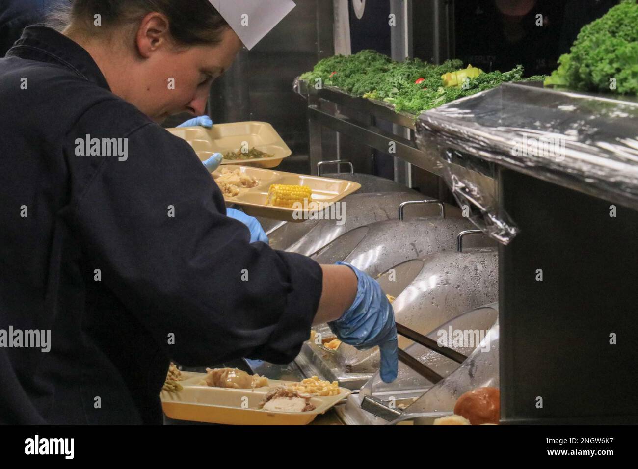 Cmdr. Antonia Shey serves Thanksgiving dinner aboard the Arleigh Burke