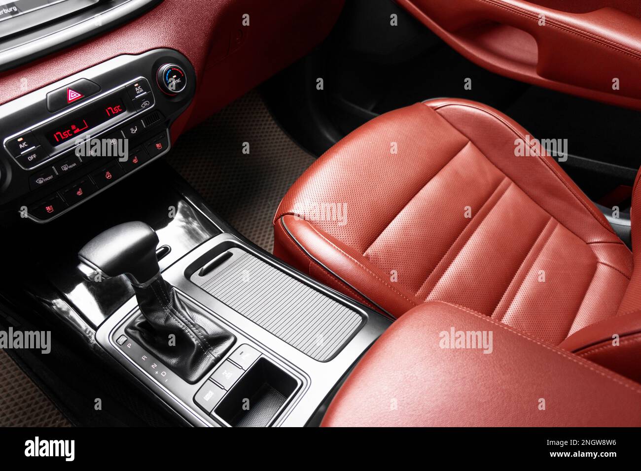 Car red leather interior. Part of red perforated leather car seat