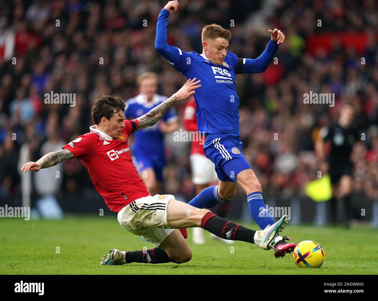 Manchester United's Victor Lindelof challenges Leicester City's Harvey Barnes during the Premier League match at Old Trafford Stadium, Manchester. Picture date: Sunday February 19, 2023. Stock Photo