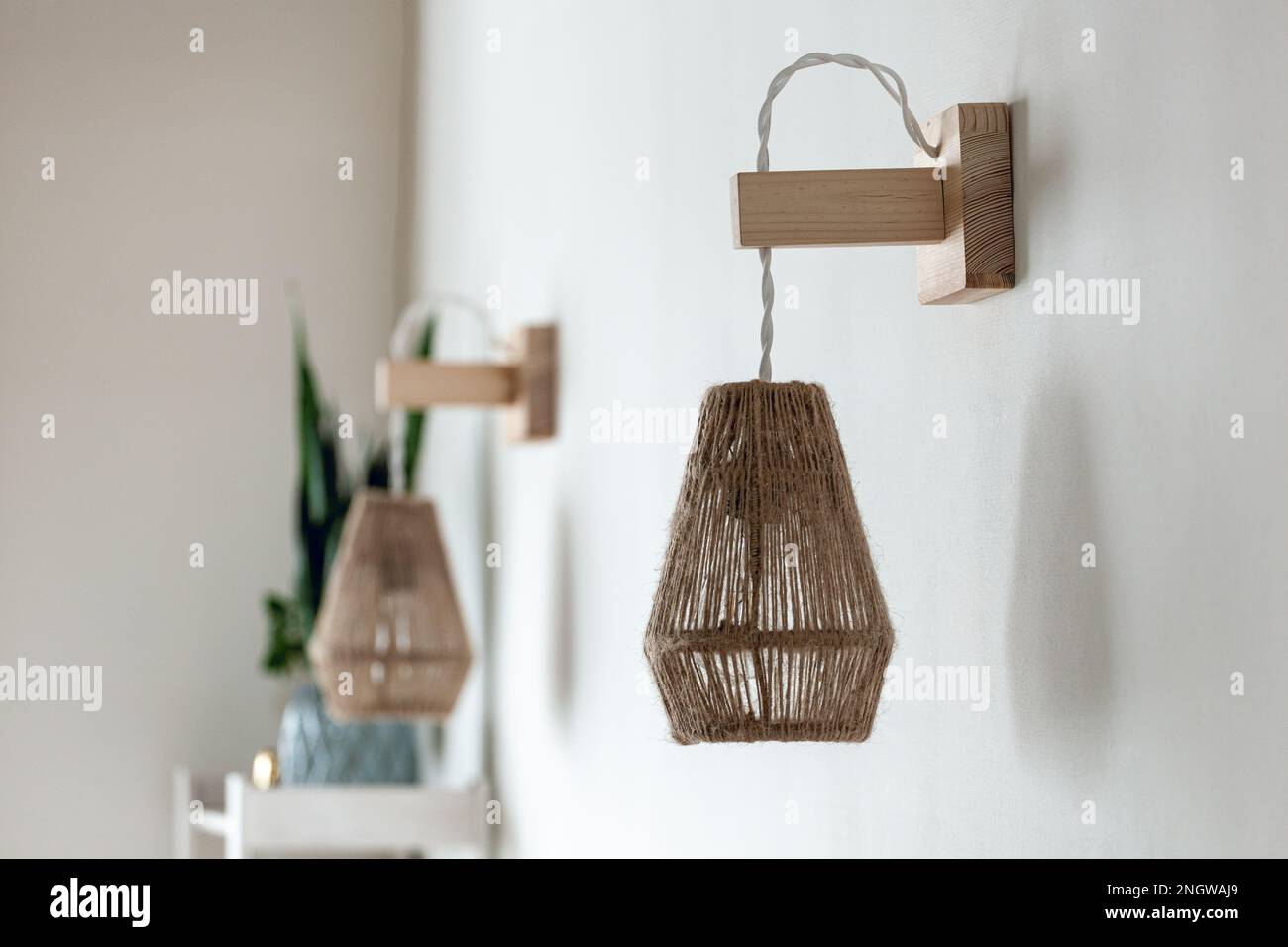 Two Jute rope light lamps fixture with wood wall mount Stock Photo Alamy
