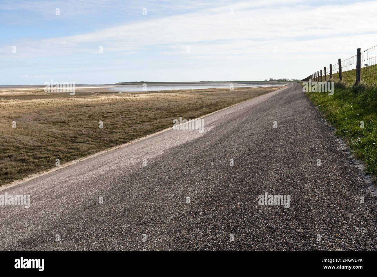 Road along dike at Texel Stock Photo Alamy