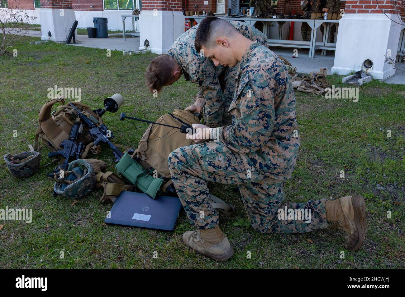 A U.S Marine with the 26th Marine Expeditionary Unit (MEU), inspects gear during Intelligence Interoperability (Intel Interop) at Stone Bay, North Carolina, Nov. 30, 2022. The 26th MEU participated in Intel Interop to enhance understanding of multi-disciplinary intelligence functions across the Marine Air-Ground Task Force. Intel Interop is part of the larger MAGTF Interoperability course, an intermediate-level pre-deployment training program event, facilitated by Expeditionary Operations Training Group. Stock Photo