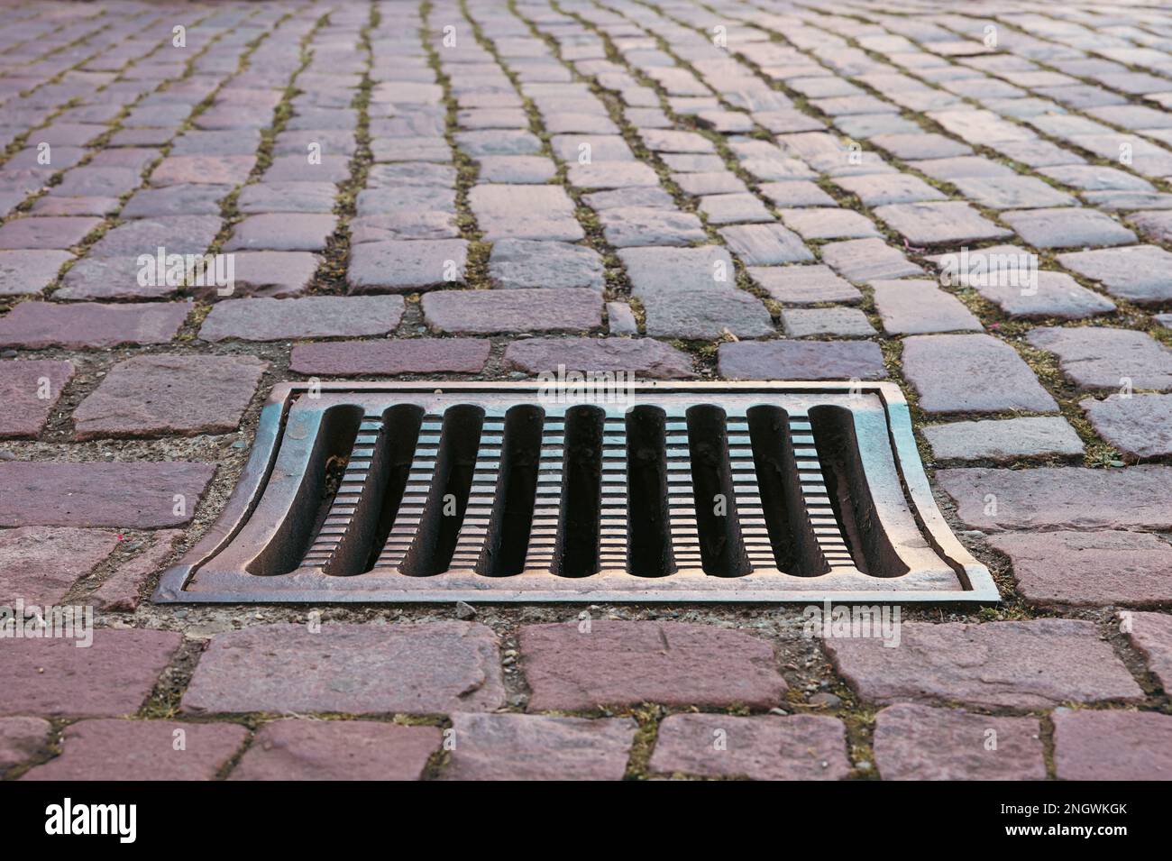 street grate for draining rainwater in the city of Kaysersberg France Stock Photo