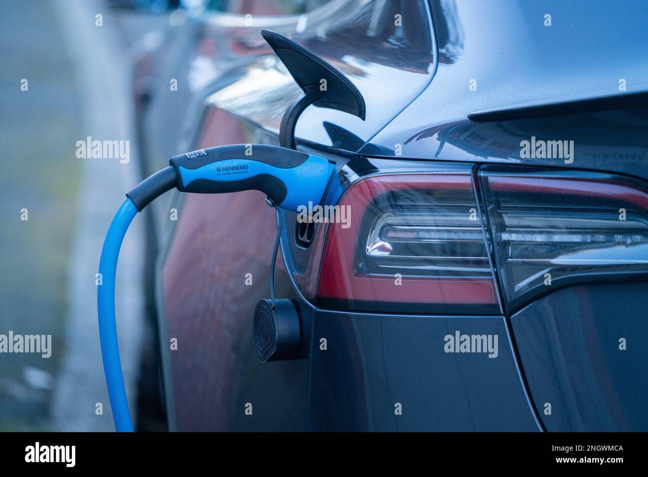 London, UK. 19 February 2023. An electric car plugged to a charging