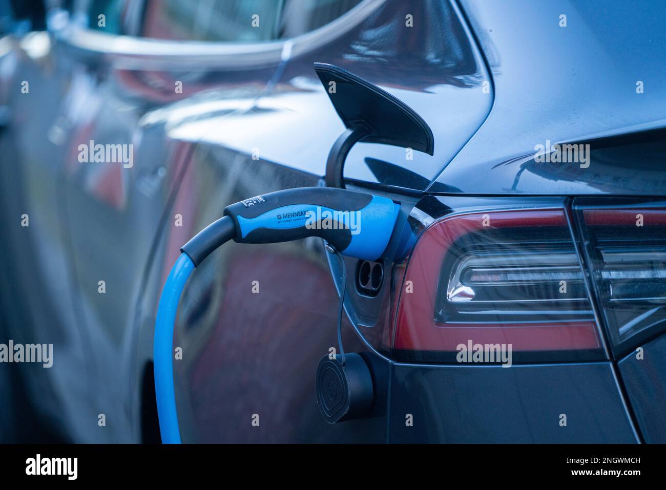 London, UK. 19 February 2023. An electric car plugged to a charging