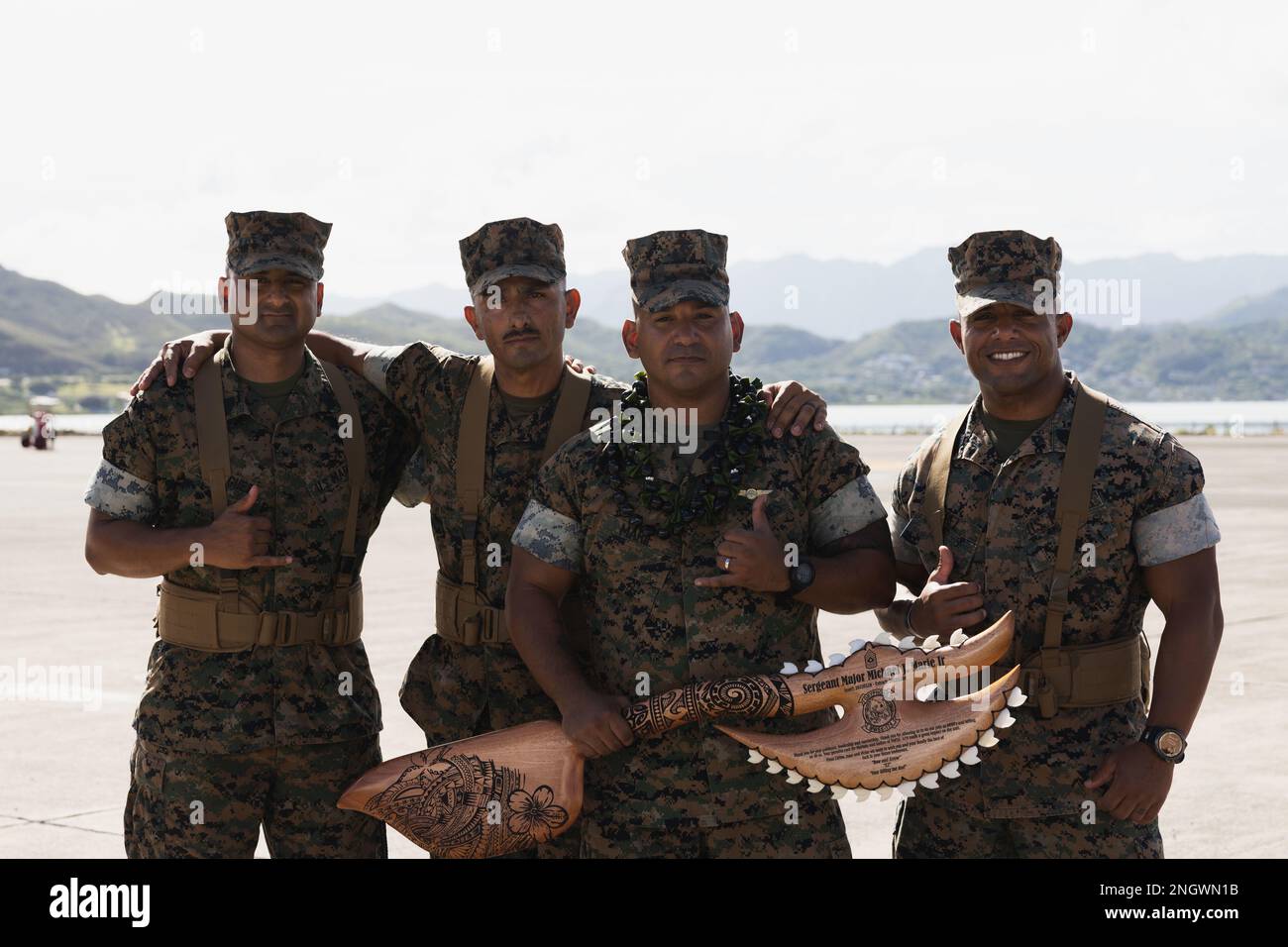 From left to right, 1st Sgt. Victor Rodriguez, 1st Sgt. Juan Elizondo, Sgt. Maj. Michael Marie Jr., and 1st Sgt. Carlos Perez pose for a group photo after a relief and appointment ceremony, Marine Corps Air Station Kaneohe Bay, Marine Corps Base Hawaii, Nov. 29, 2022. Sgt. Maj. Michael Marie Jr., offgoing sergeant major, MWSS-174, was relieved by Sgt. Maj. Kevin Hopkins, oncoming sergeant major, MWSS-174. Stock Photo