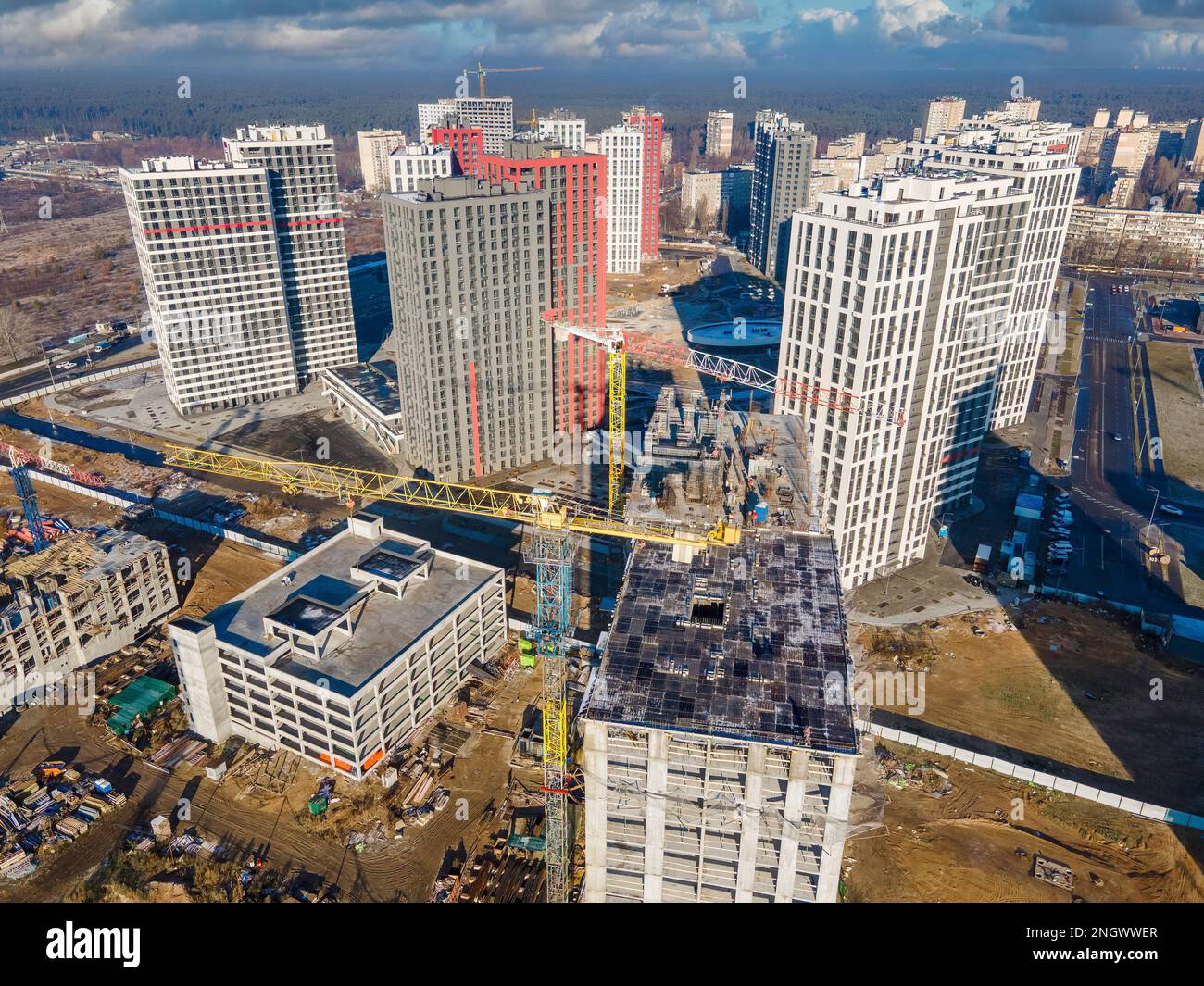 Big construction site with cranes from above. New real estates construction. Construction site in a sunny day Stock Photo