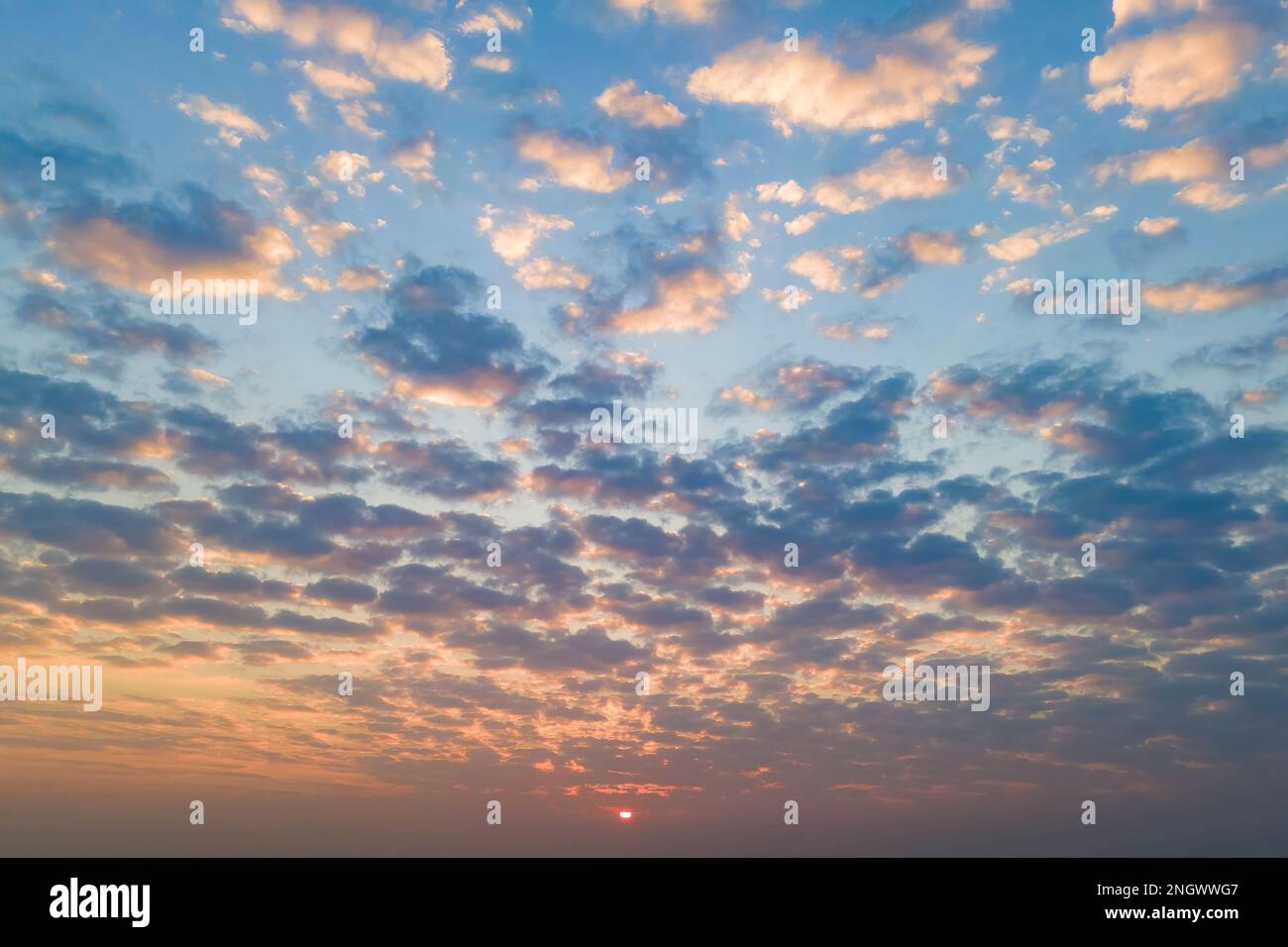 Cirrus clouds on the sunset sky. Nature background Stock Photo