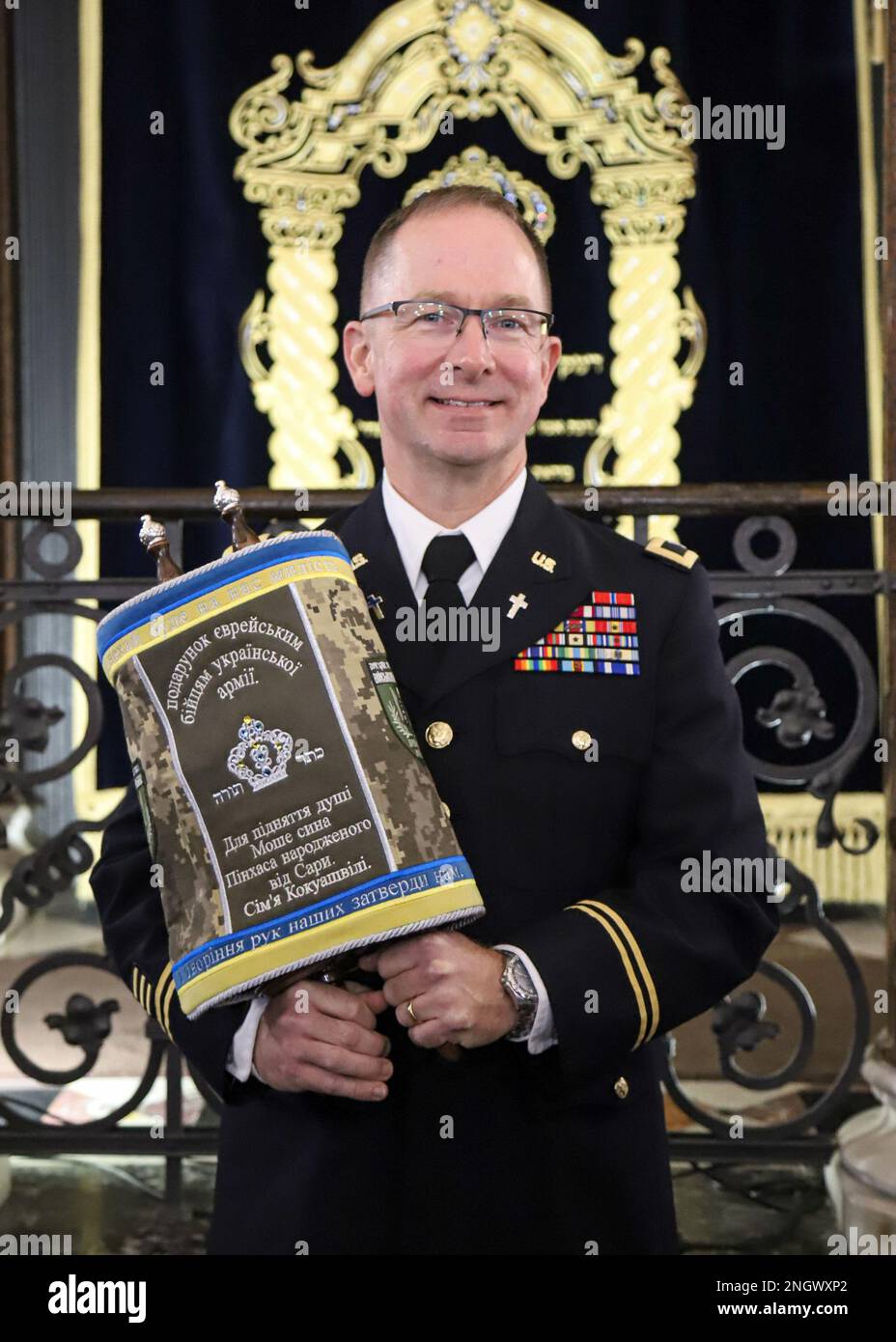 WARSAW, Poland - U.S. Army V Corps Chaplain Col. Benjamin Sprouse holds a Torah Scroll dedicated to the Ukrainian Army after the signing ceremony was completed, Nov. 29, 2022, Warsaw, Poland. Jewish Chaplains alongside distinguished guests, refugees from Ukraine and U.S. ally partner nations attended the event to support the Ukrainian Chaplaincy’s religious support efforts. Stock Photo