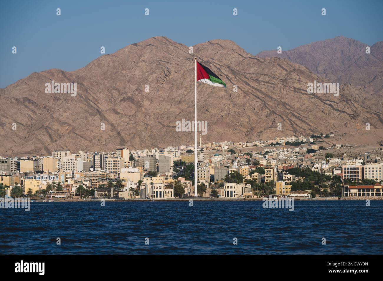 Aqaba Flagpole with the Great Flag of the Arab Revolt or Flag of the Hejaz Stock Photo
