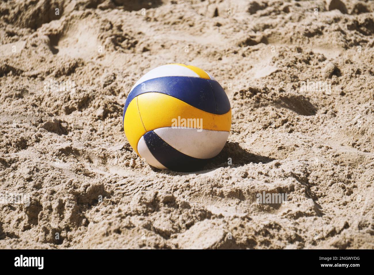 beach volleyball ball lying in the sand - summer trend sport Stock Photo