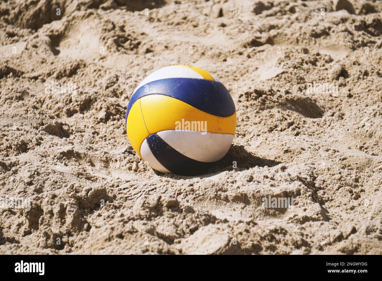 beach volleyball ball lying in the sand summer trend sport Stock