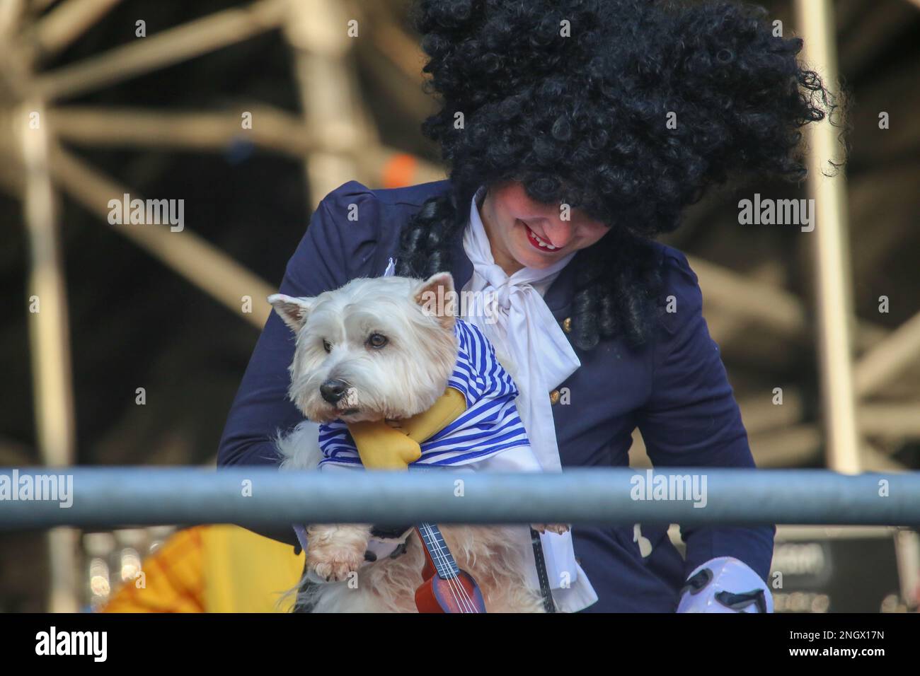 Aviles, Spain, 19th February, 2023: A lady and her musician dog during the Antroxaes Pet Contest on February 18, 2023, in Aviles, Spain. Credit: Alberto Brevers / Alamy Live News Stock Photo