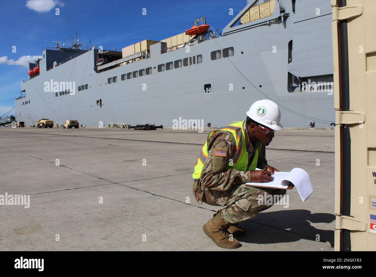 Sgt. 1st Class Julian Bailey, Transportation Documentation Specialist, verifies container