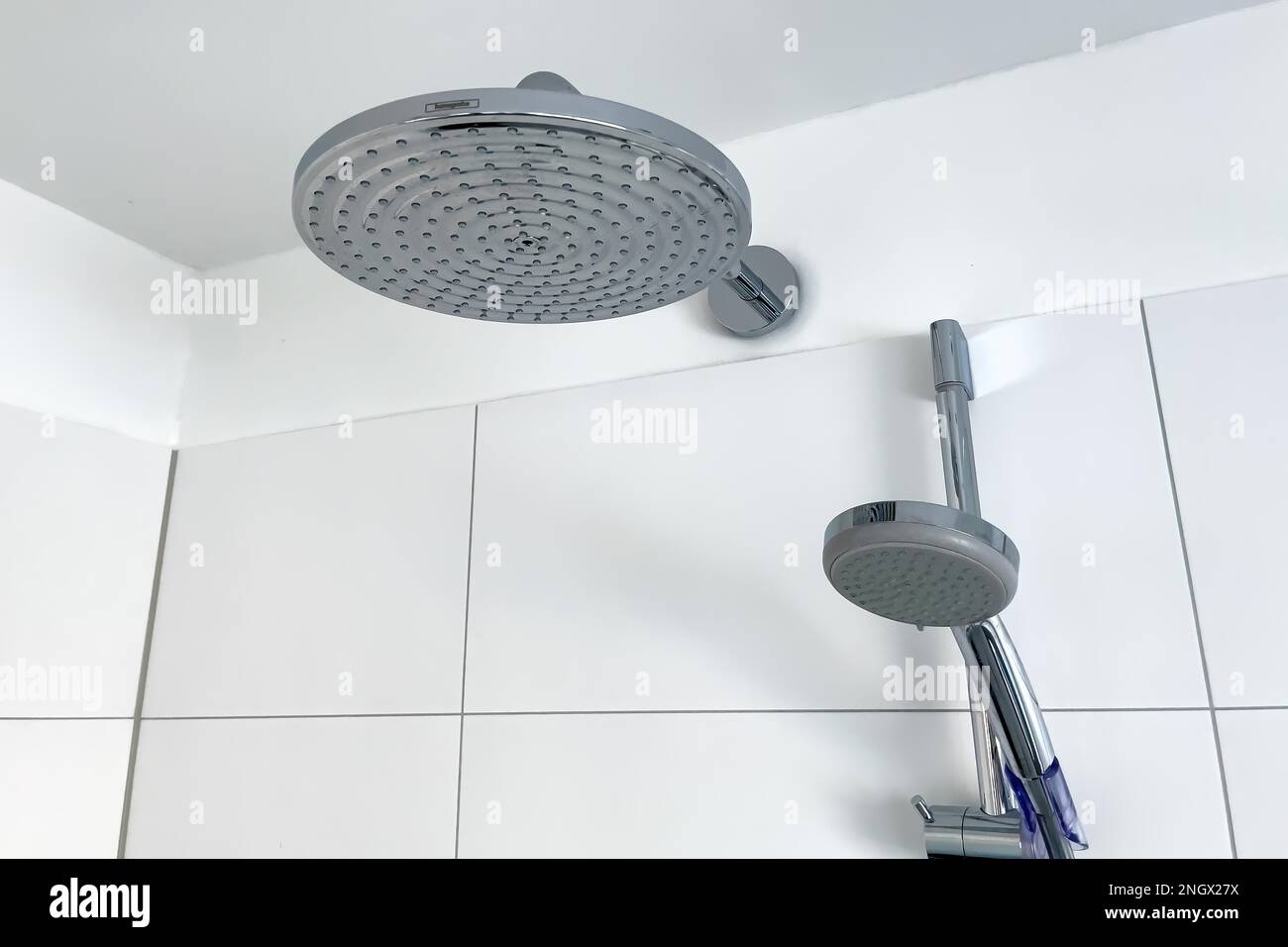 Shower with two shower heads left large shower head type rain shower