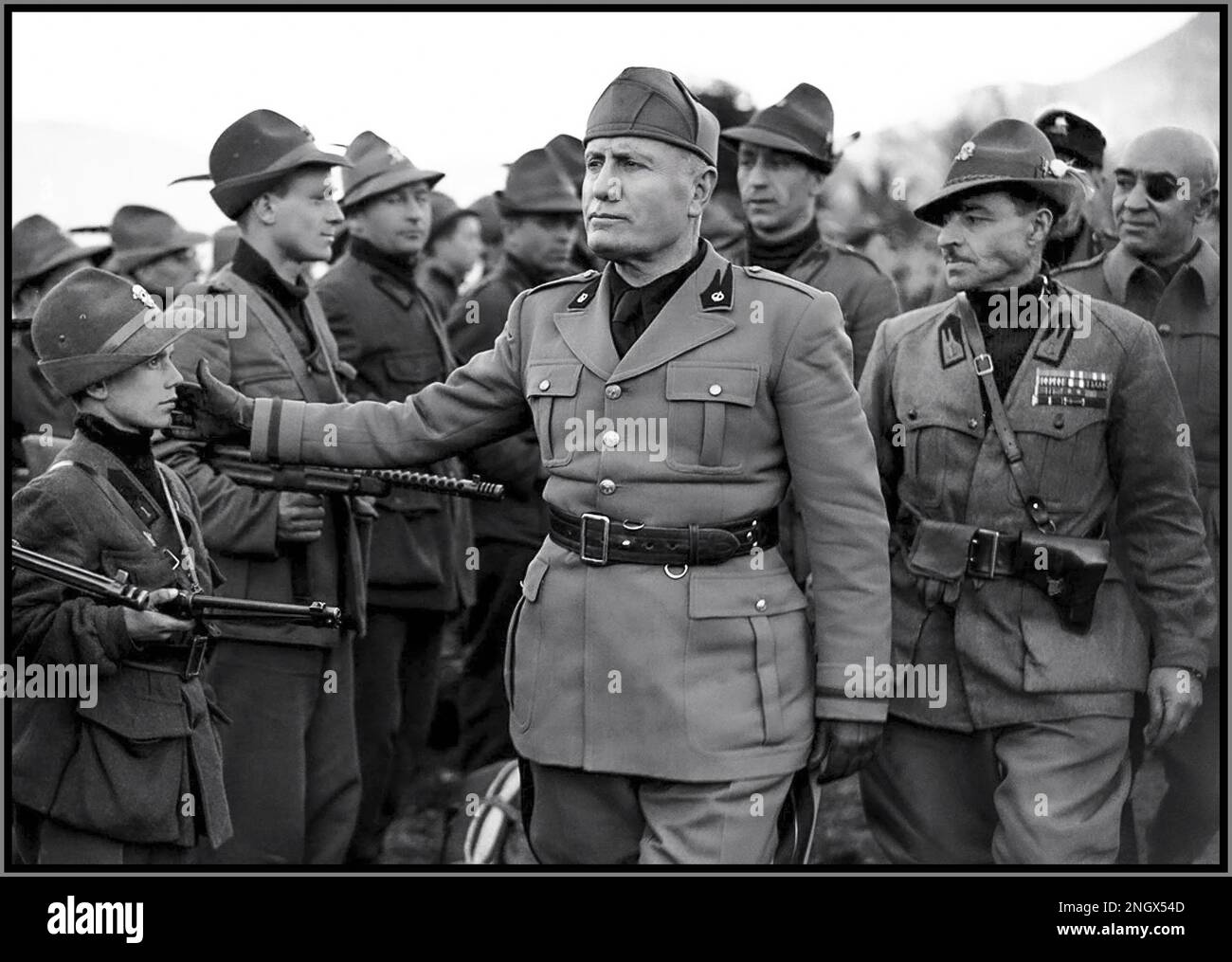 Benito Mussolini, Facist WW2 Italy Italian Axis leader (DUCE), reviewing 5th Alpine Mobile Black Brigade, Brescia, 1945 World War II Second World War Benito Amilcare Andrea Mussolini was an Italian politician and journalist who founded and led the National Fascist. Executed 28 April 1945, Giulino, Azzano, Italy Stock Photo