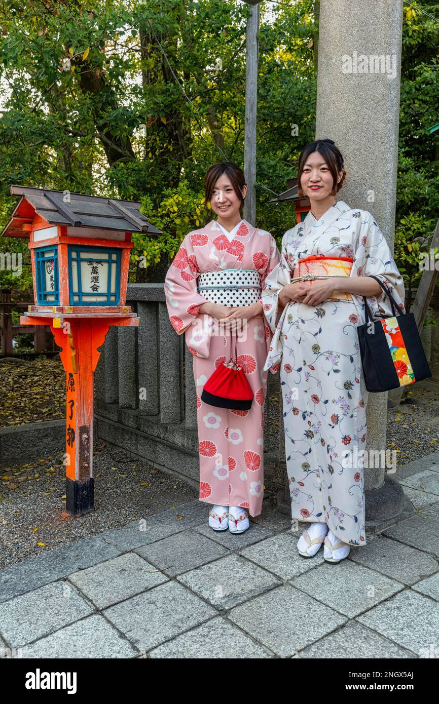 Kyoto Japan. Two women dressed in traditional kimono garment Stock