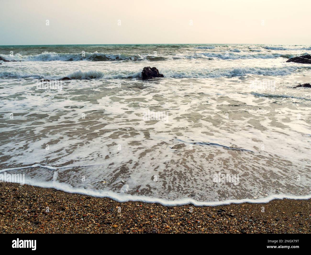Surf on the rocky beaches of Mijas during an easterly storm. Stock Photo