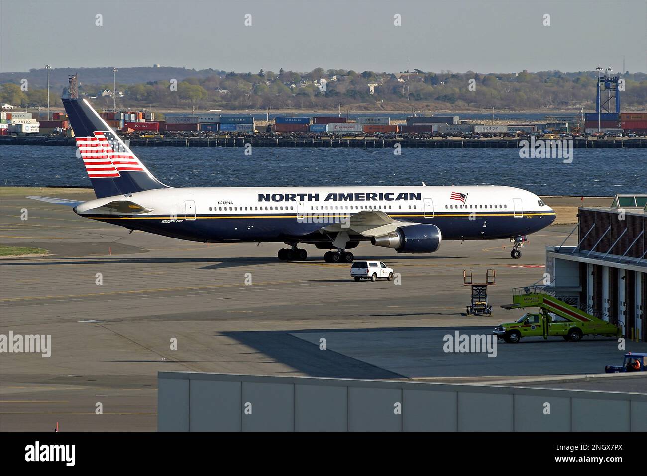 North American Airlines Boeing 767 charter plane parked on airport tarmac, colorful USA flag livery Stock Photo