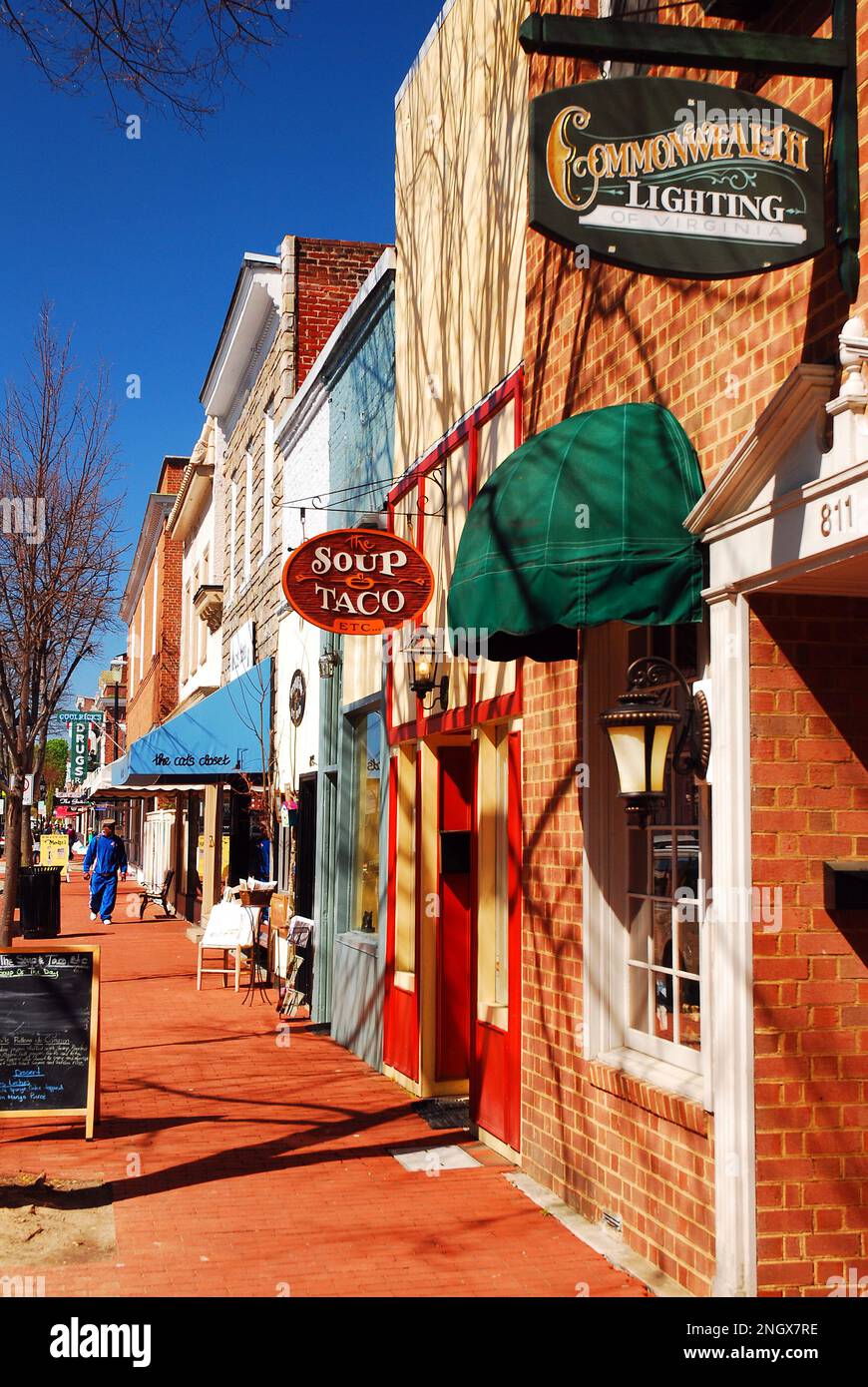 Small cafes and boutique shops line the sidewalk in downtown