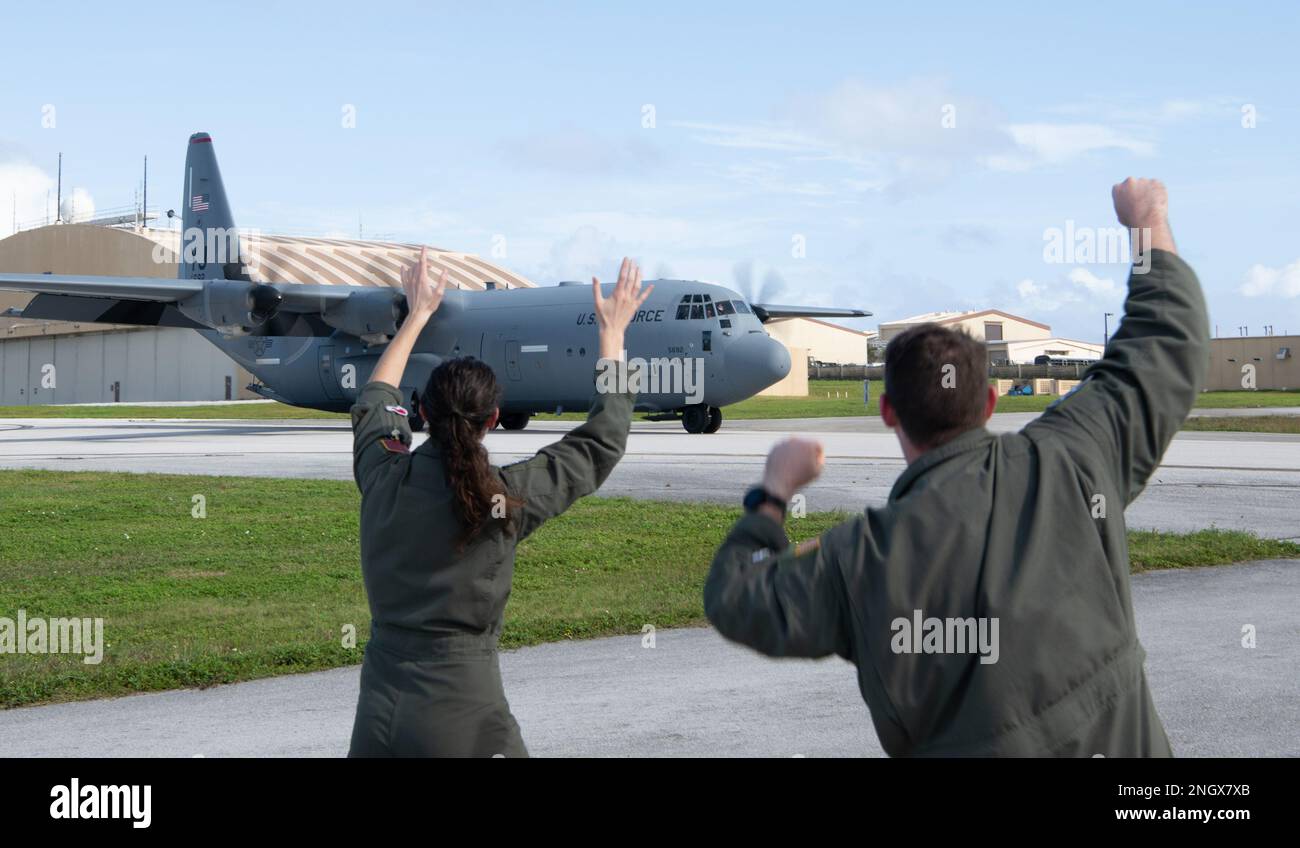 (Left to right) U.S. Air Force Capt. Jenn Brenton, and Capt. Andrew Zaldivar, 36th Expeditionary Airlift Squadron, greet Yokota’s C-130J Super Hercules at Andersen Air Force Base, Guam, Nov. 30, 2022, during Operation Christmas Drop 2022. Three Yokota’s C-130Js carried with Airmen who participated in OCD arrived at same day. OCD is one of many events where U.S. and partner nation forces operate side by side, with this event emblematic of our mutual respect and cooperation with our friends and neighbors. Stock Photo