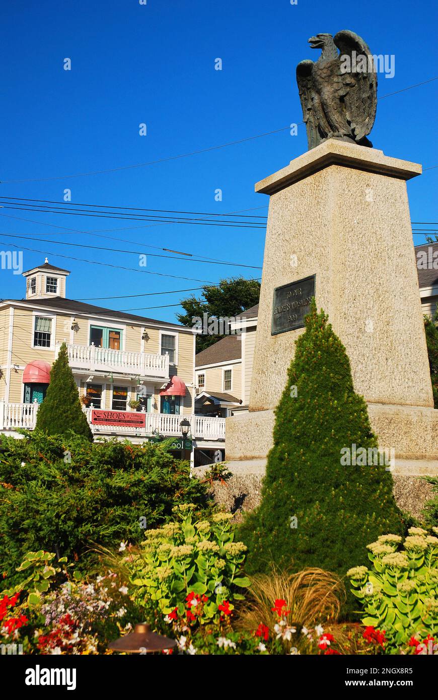 A stone memorial to the military members who died in the wars stands in