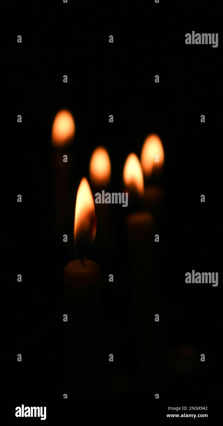 Burning candles in the dark hi-res stock photography and images - Alamy