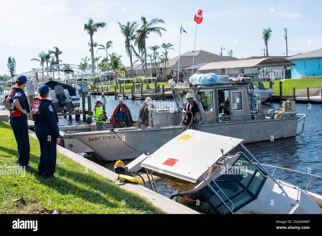 The Coast Guard observes the offloading of fuel from a boat wrecked in Hurricane Ian, Cape