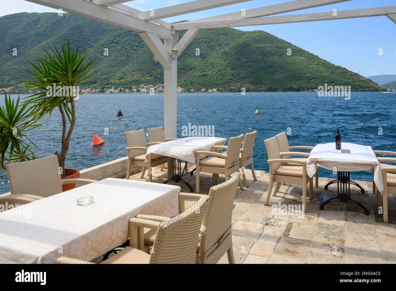 Perast, Montenegro - June 6, 2022: Seaside restaurant cafe in the picturesque town of Perast in Montenegro Stock Photo