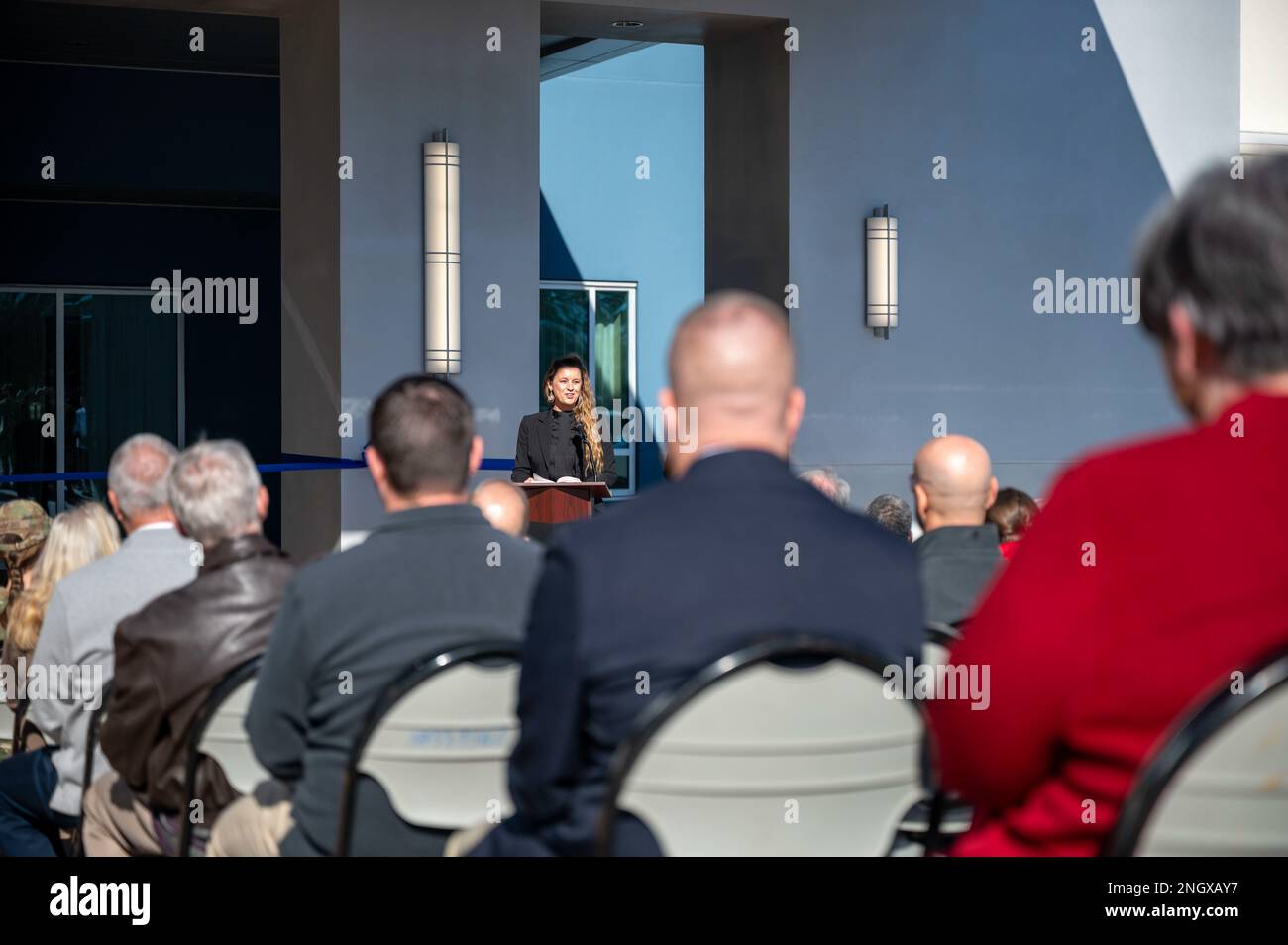 Razorback Inn Janae Sergio, Chief of Air Force Lodging, speaks during a ribbon ...