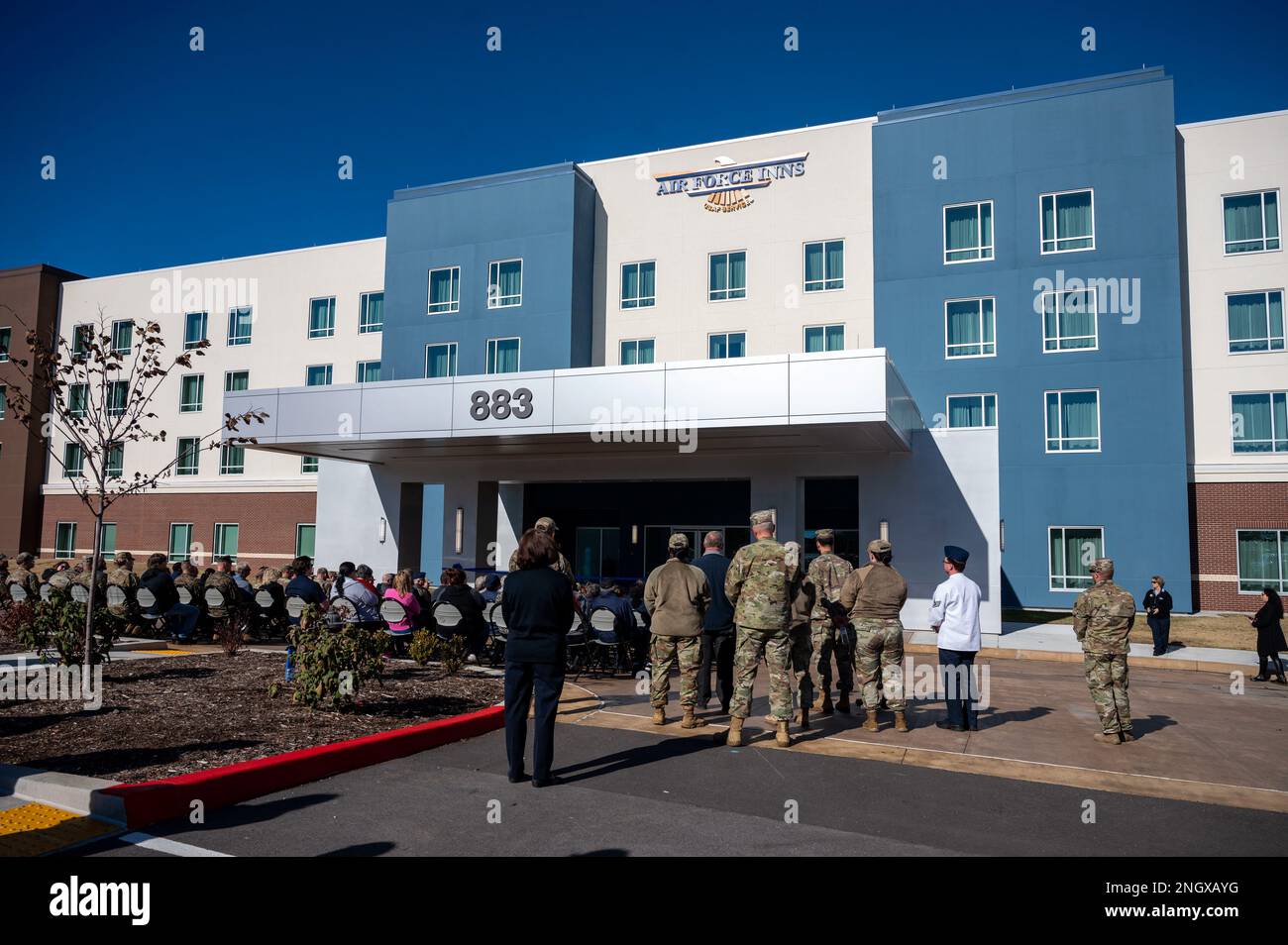 A ribbon cutting ceremony for the new Razorback Inn takes place at