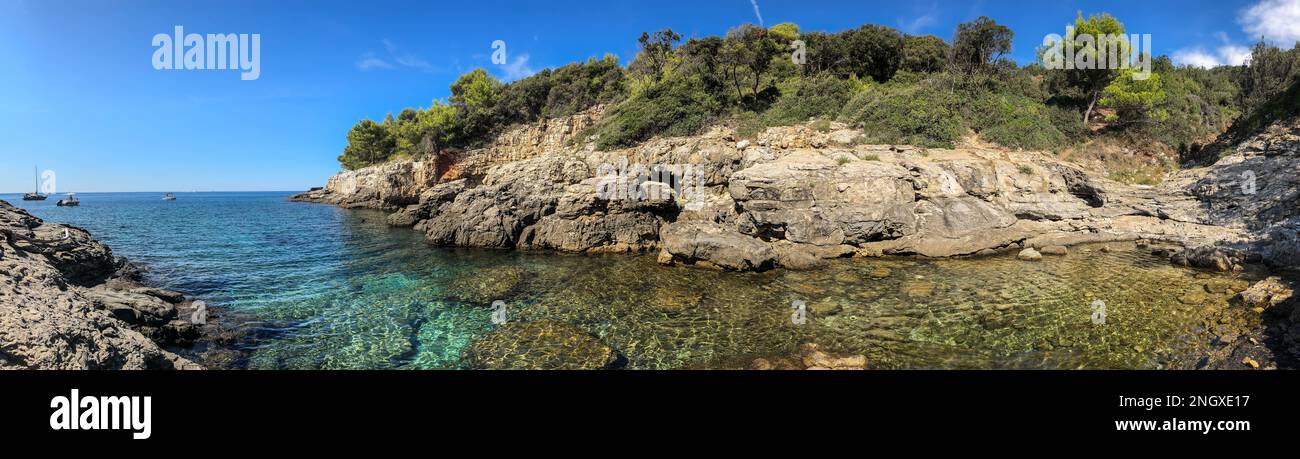 Panorama Scenery of Rocky Beach in European Pula. Beautiful View of Bay in Croatia with Turquoise Adriatic Sea and Bay during Summer Day in Istria. Stock Photo