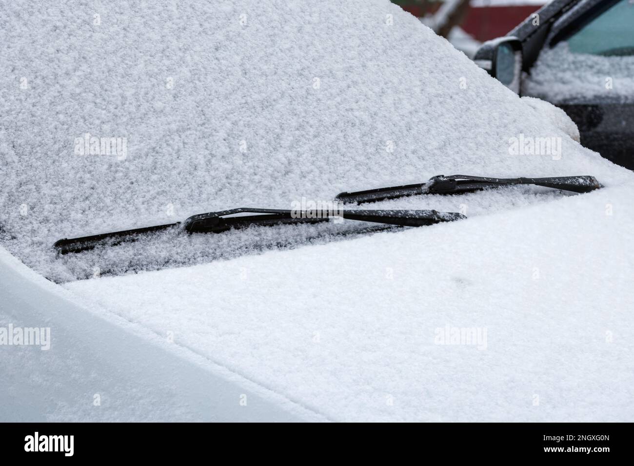 snow covered car windshield, wipers and closeup fullframe