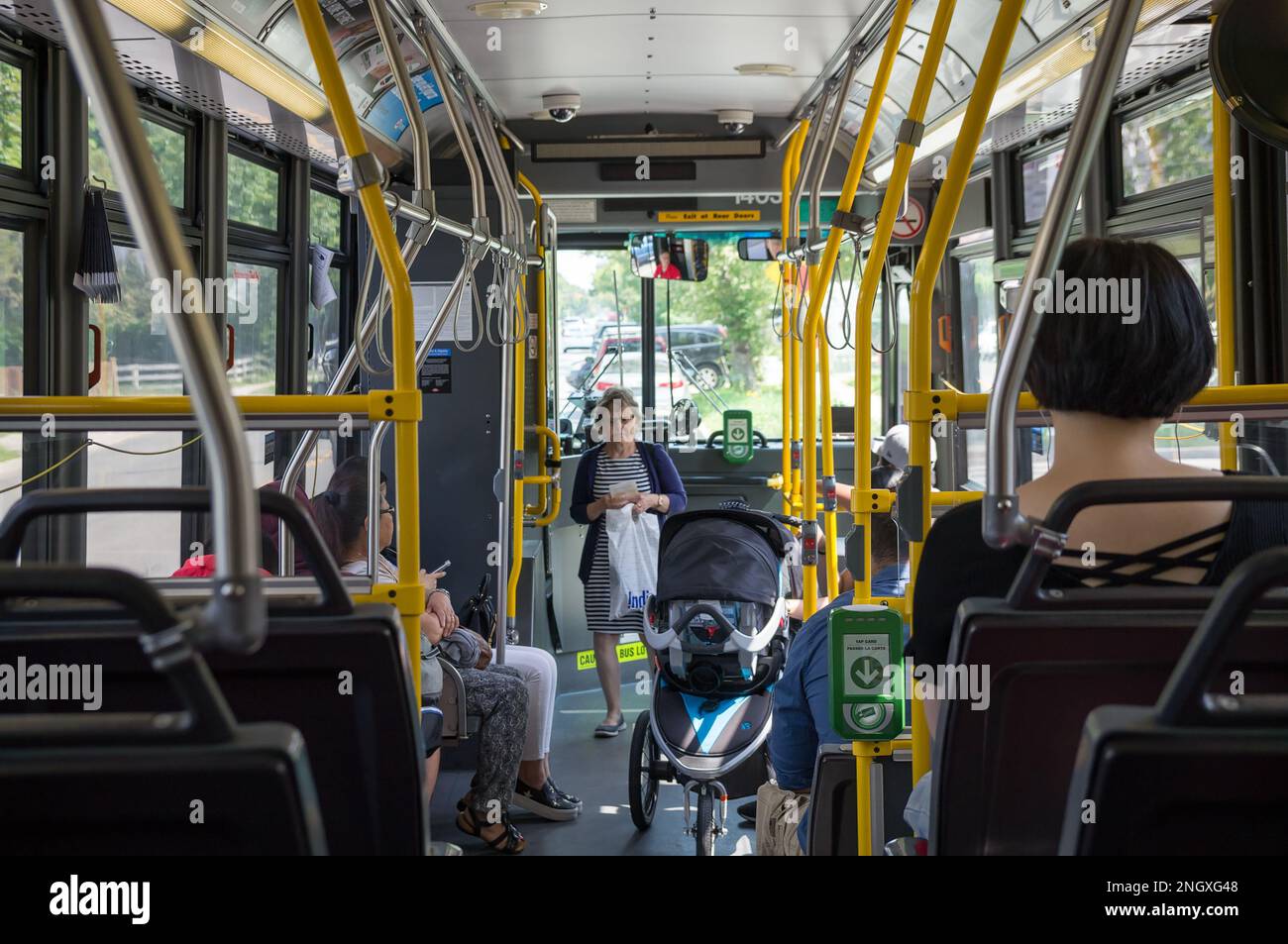 Toronto, Canada - 09 01 2018: Passengers in Toronto Transit Commission bus. Riders can pay their fares with Presto Card using wireless validators Stock Photo