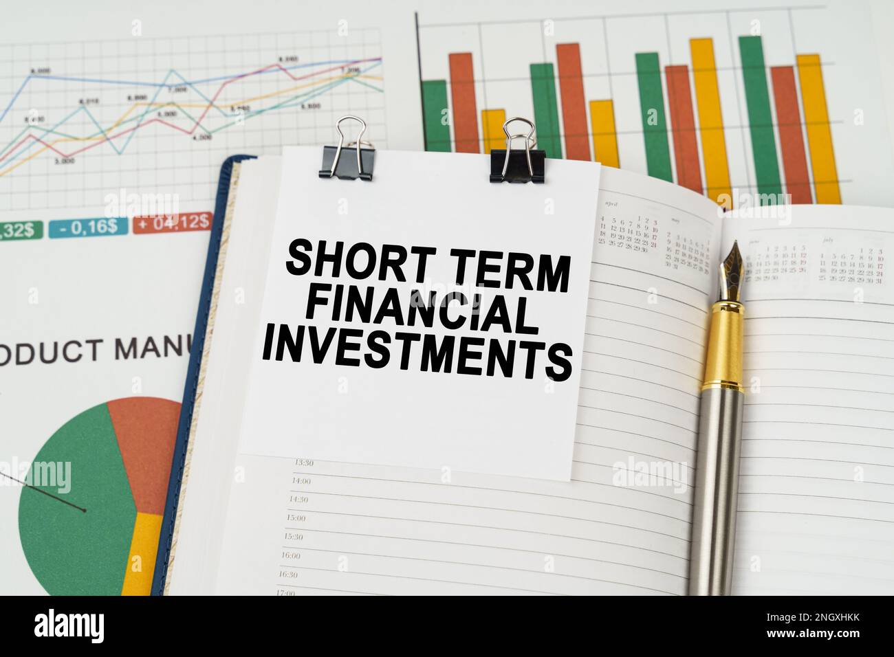 Business concept. On the business charts lies a pen, a notepad with note paper with the inscription - Short Term Financial Investments Stock Photo