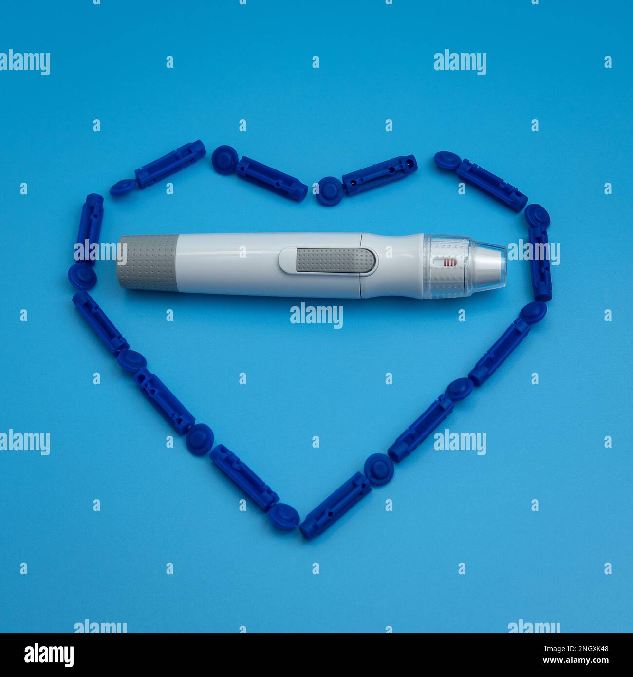 Lancet pen is inside the heart from sterile disposable lancets isolated
