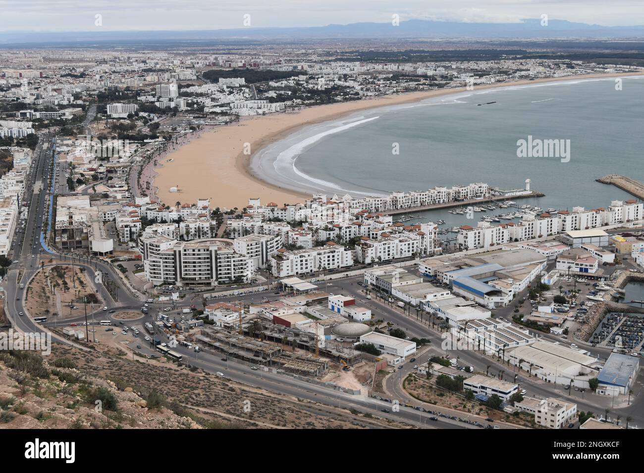 Agadir Bay and Agadir Marina viewed from the Kasbah on a dry February day. Stock Photo