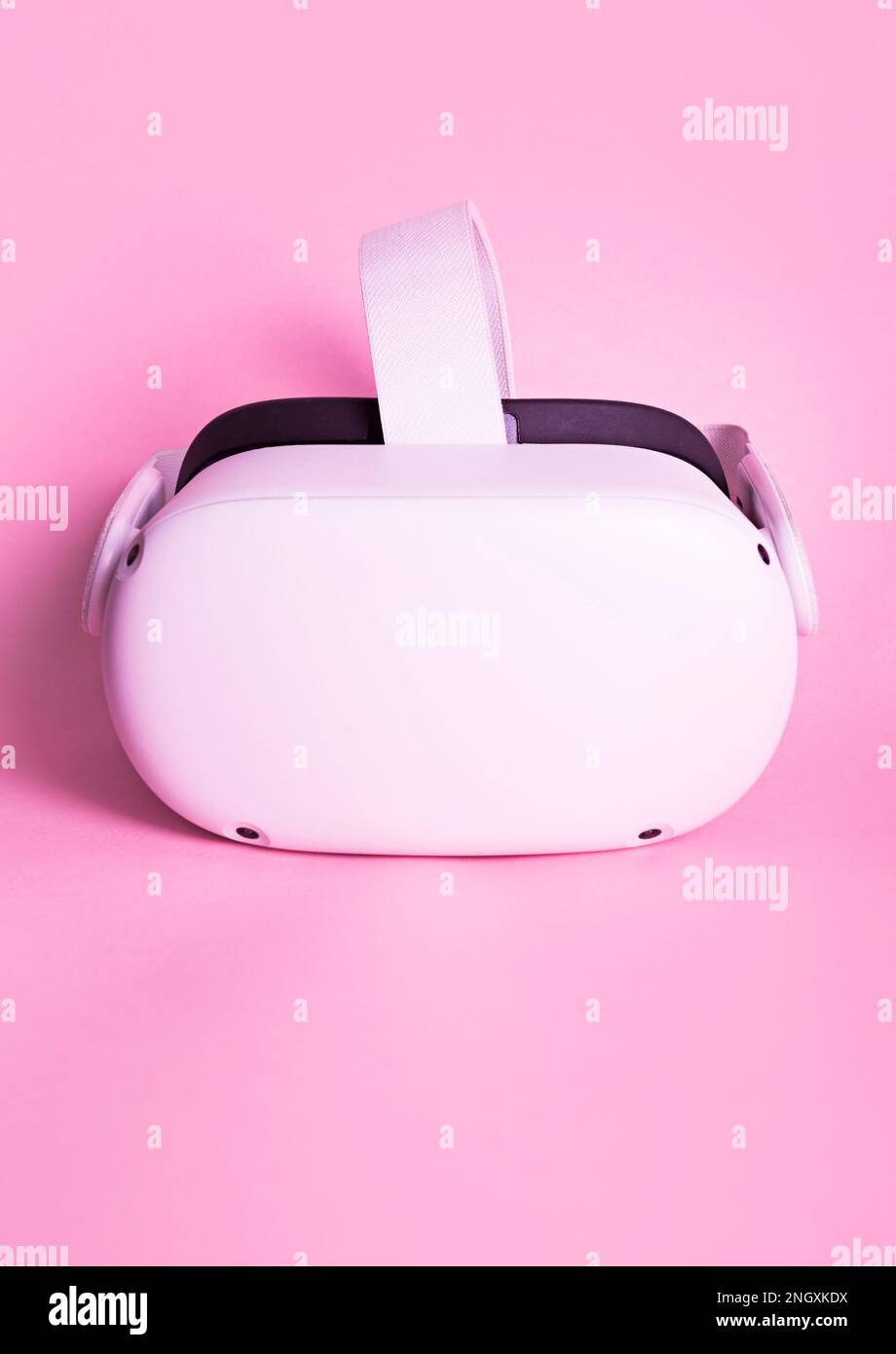 Virtual reality glasses on a pink background. Concept of innovation, women in the world of technology. Stock Photo