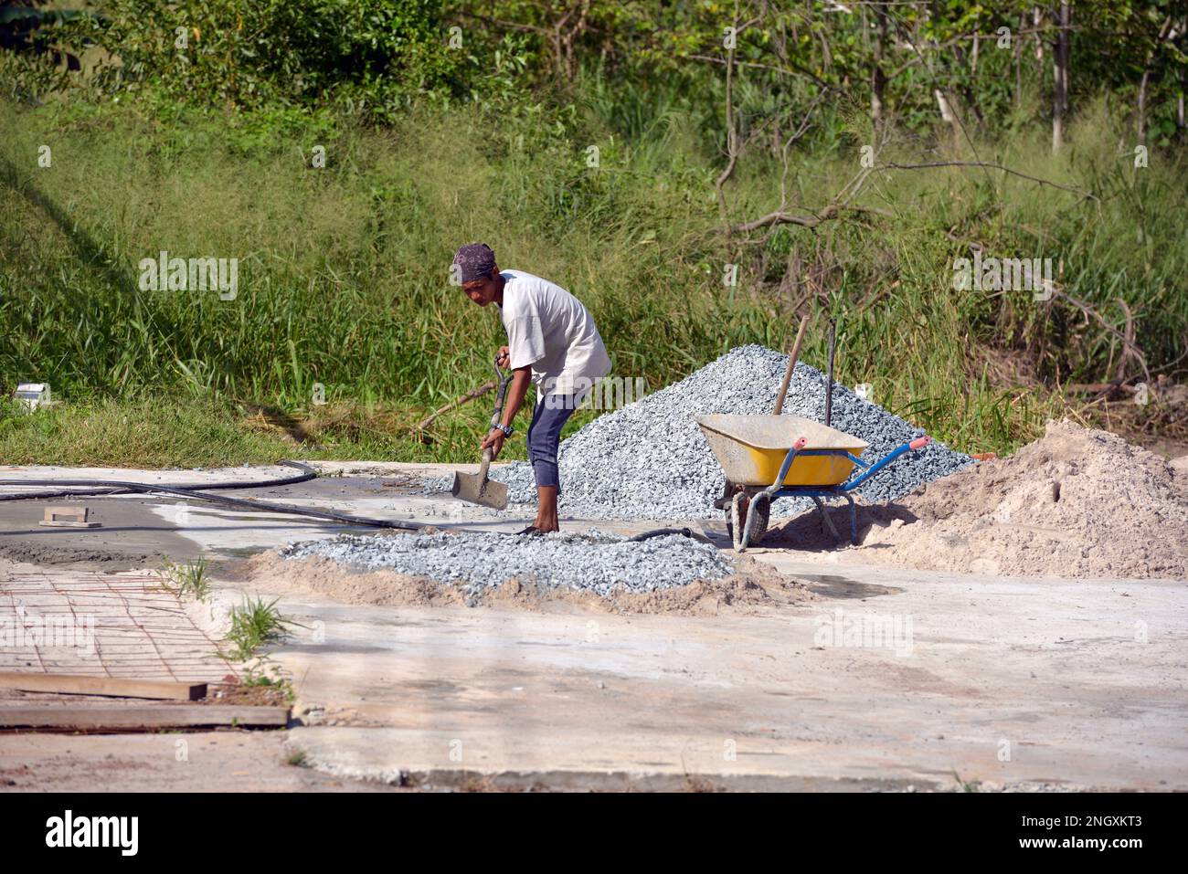 An indigenous Bajau migrant working on a construction project. Tip of Borneo, Malaysia. Stock Photo