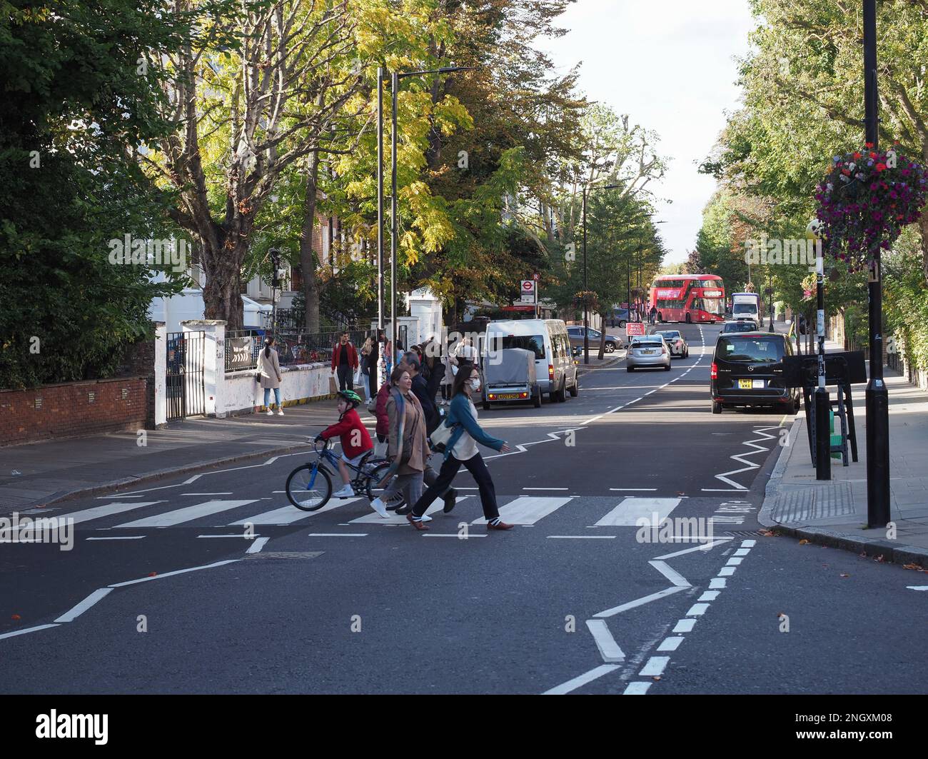LONDON, UK - CIRCA OCTOBER 2022: People crossing Abbey Road zebra