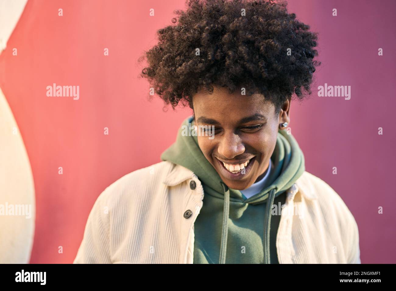 Young happy African American teen guy laughing outdoors, portrait Stock ...